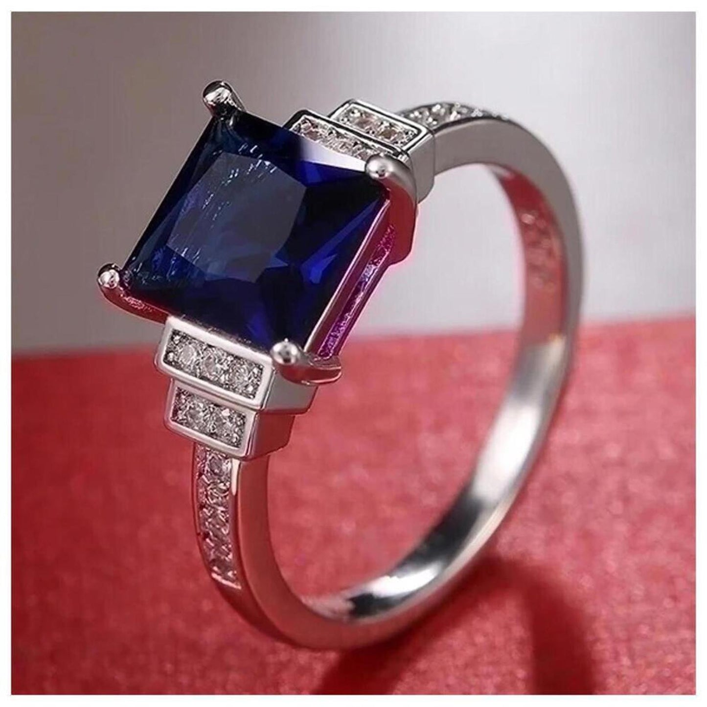 Blue princess cut ring - silver - CZs - size 6.